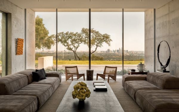 Linen book cover of Contemporary Retreats, featuring an interior living space in shades of gray. Published by Beta-Plus.