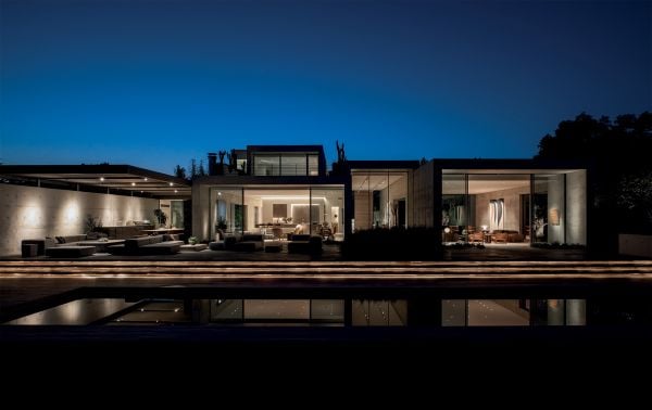 Linen book cover of Contemporary Retreats, featuring an interior living space in shades of gray. Published by Beta-Plus.