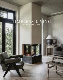 Book cover of Timeless Living Yearbook 2026: featuring a living room interior with a modern fire, wood flooring and leather chair. Published by Beta-Plus.