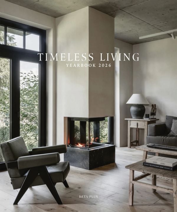 Book cover of Timeless Living Yearbook 2026: featuring a living room interior with a modern fire, wood flooring and leather chair. Published by Beta-Plus.