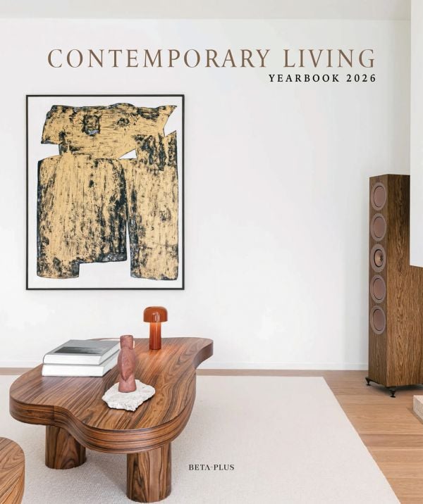 Book cover of Contemporary Living Yearbook 2026: featuring an interior with white walls, dark wood table and speaker stack. Published by Beta-Plus.