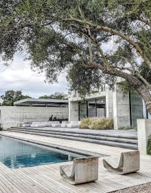 Book cover of World's Best: 50 Gardens from Around the Globe, featuring a landscaped garden with a small pond. Published by Beta-Plus.