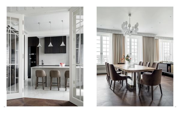 Book cover of Ariana Ahmad Design; featuring a dark interior living space with wood panelling and a modern chandelier. Published by Beta-Plus.