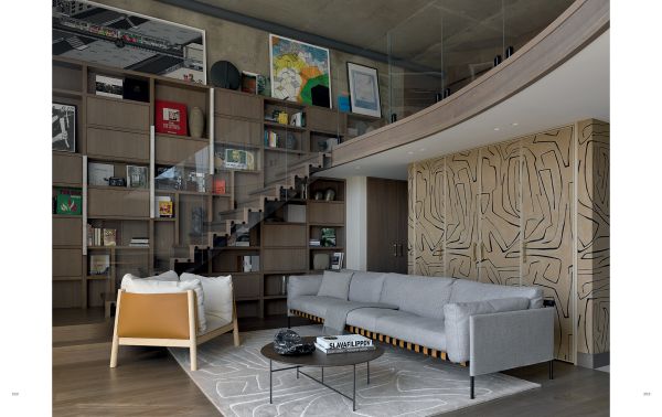 Book cover of Ariana Ahmad Design; featuring a dark interior living space with wood panelling and a modern chandelier. Published by Beta-Plus.