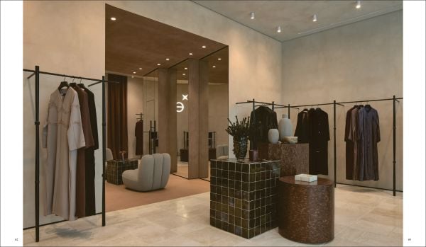 Book cover of World's Best - 50 Boutiques From Around the Globe; featuring the interior of a fashion store with clothed mannequins. Published by Beta-Plus.