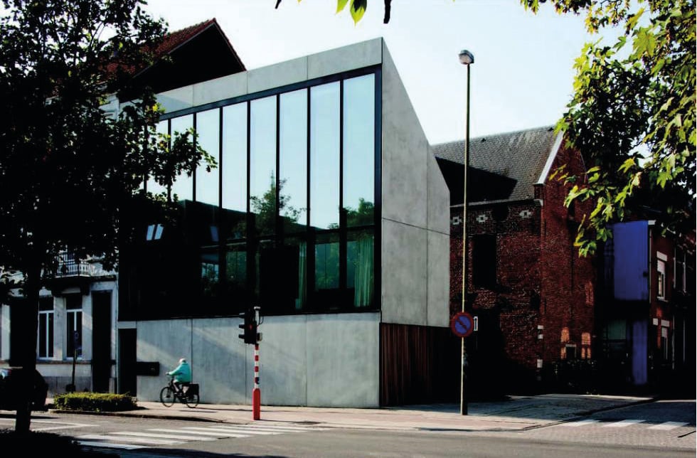 Two colour photographs of exterior architectural structures, Belgium New Architecture 7 in black font to upper left.