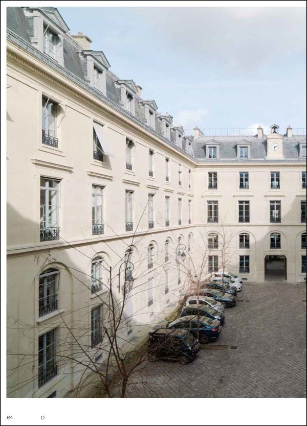 Man on white plinth taking photo of landscape, on white cover, Creatures of the City in black font above