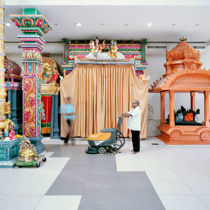 Book cover of Promenades: Photography and Architecture; featuring a woman in sparkly red dress peering through taupe drapes. Published by Park Books.