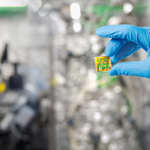Book cover of Promenades: Photography and Architecture; featuring a woman in sparkly red dress peering through taupe drapes. Published by Park Books.