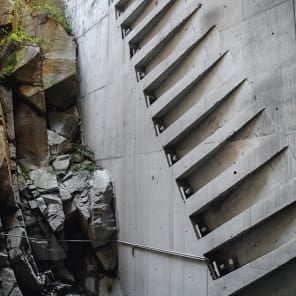 Seascape in Portugal with rocks, curved wall structures, Portugal Lessons Environmental Objects. in black font on white bottom banner