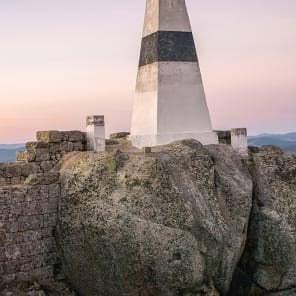 Seascape in Portugal with rocks, curved wall structures, Portugal Lessons Environmental Objects. in black font on white bottom banner