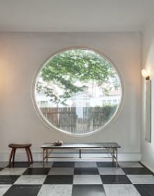White flat roof villa surrounded by green trees, JOSEF FRANK: VILLA CARLSTEN in white font below
