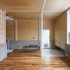 AT HOME IN STEEL Residential Construction in Steel - Thoughts on Space and Structure in brown font on white cover.