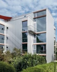 AT HOME IN STEEL Residential Construction in Steel - Thoughts on Space and Structure in brown font on white cover.
