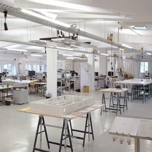 Doodles in black of workspace tables, on white cover, Experimental Zone in black font down left edge