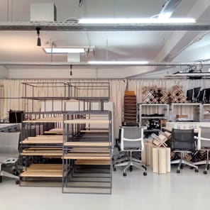 Doodles in black of workspace tables, on white cover, Experimental Zone in black font down left edge