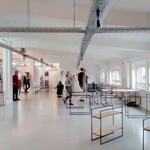 Doodles in black of workspace tables, on white cover, Experimental Zone in black font down left edge