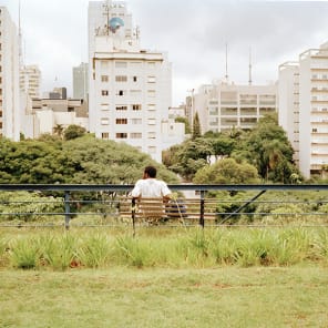Book cover of Access for All: São Paulo's Architectural Infrastructures, with a public outdoor rooftop swimming pool with bathers, under blue sky. Published by Park Books.