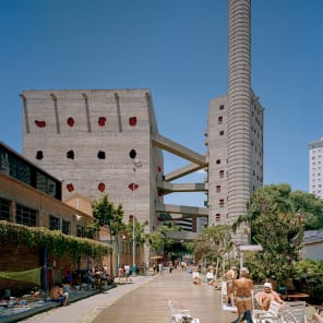 Book cover of Access for All: São Paulo's Architectural Infrastructures, with a public outdoor rooftop swimming pool with bathers, under blue sky. Published by Park Books.