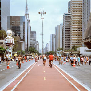 Book cover of Access for All: São Paulo's Architectural Infrastructures, with a public outdoor rooftop swimming pool with bathers, under blue sky. Published by Park Books.