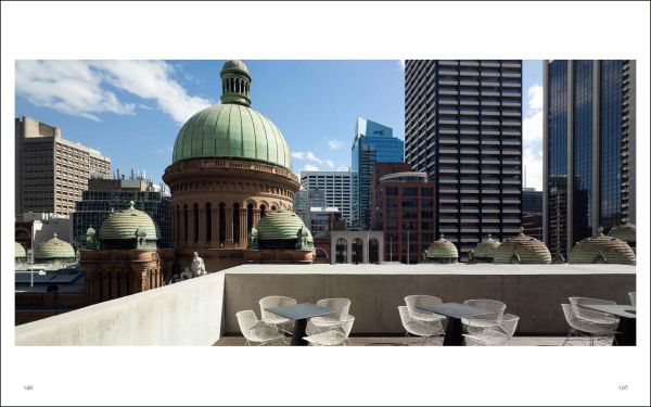 Salmon pink cover with black scale patterns and circle, Angelo Candalepas Buildings and Project in black font above and below.