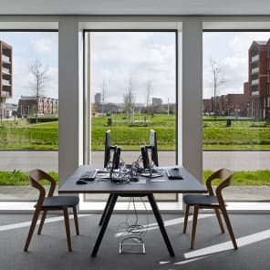 Low angled shot of centre of brick structure, panes of glass to centre, white border, BRICK 20 Outstanding International Brick Architecture in black font to top left.