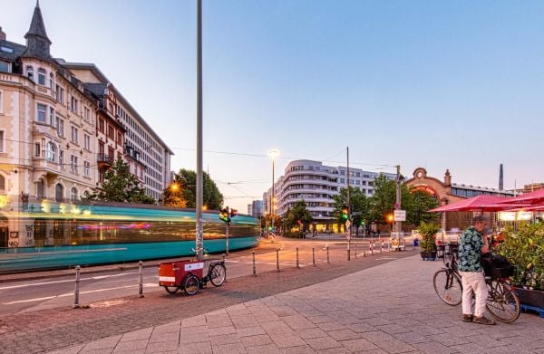 Side façade of residential complex with roof terraces and balconies, Stefan Forster Architekten in white font to upper left.