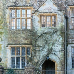 Green English landscape, white cover, Manor Lessons Commons Revisited in black font below.