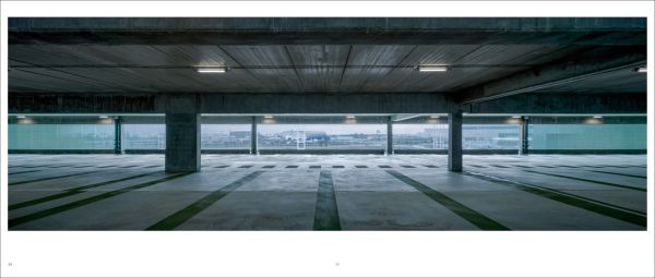 Landscape shot of exterior of Toulouse Exhibition and Convention Center, on grey cover, OMA – Toulouse Exhibition and Convention Center in black and grey font below.