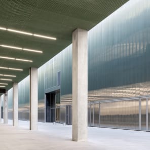 Landscape shot of exterior of Toulouse Parc des expositions et Centre de convention, on grey cover, OMA – Toulouse Exhibition and Convention Center in black and grey font below.