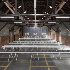 White cover with colour cut out, fold and stick house shape and Swissness Applied in large black font above and below