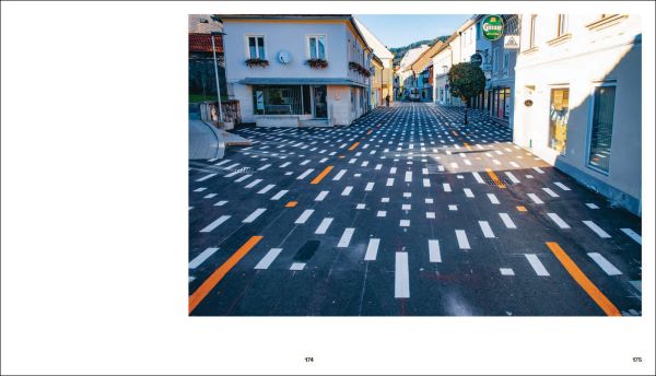 Pale grey cover with URBANISM in fine black outline and Basics of Urbanism in pinky red font