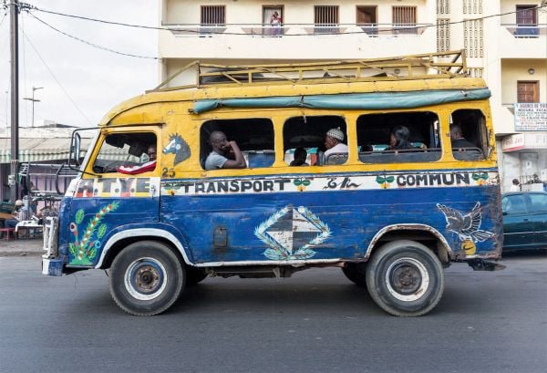 Book cover of African Modernism: The Architecture of Independence. Ghana, Senegal, Côte d'Ivoire, Kenya, Zambia, with the modern Hotel Ivoire, two suited men below. Published by Park Books.