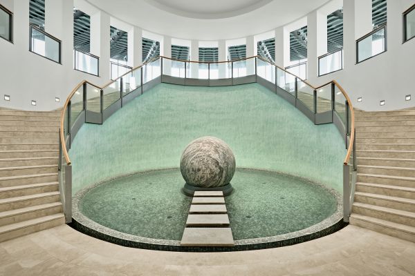 Book cover of Architekten von Gerkan, Marg und Partner, with UFO-shaped building of Palacongressi Conference Center in Italy, with water fountain in front. Published by Park Books.