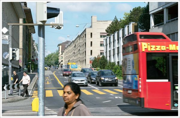 Book cover of Esch Sintzel Architekten: Buildings and Projects, featuring a freight train with highrise buildings behind. Published by Park Books.