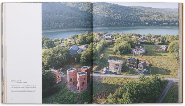 Book cover of Rural Vision: Building Dialogues Through Architecture, featuring a wood building with a person looking out onto a city, with their back to the viewer. Published by Park Books.