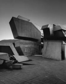 Book cover of We Günther Domenig: Reevaluation of a Legend; featuring a figure with electrodes on head and face. Published by Park Books.