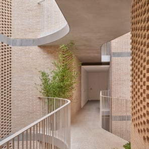 Book cover of Brick 26: Outstanding International Brick Architecture; featuring a modern white brick building with perforated panels and geometric forms. Published by Park Books.