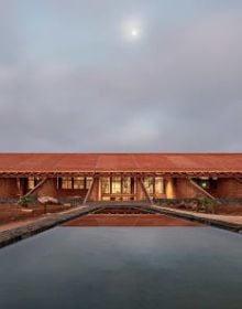 Book cover of Brick 26: Outstanding International Brick Architecture; featuring a modern white brick building with perforated panels and geometric forms. Published by Park Books.