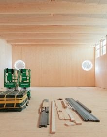 Book cover of Building for Disassembly: Temporary Timber Sports Halls; featuring a large, timber frame for side of building. Published by Park Books.