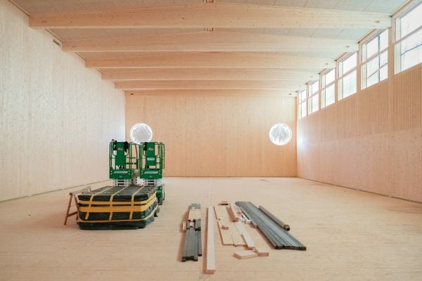 Book cover of Building for Disassembly: Temporary Timber Sports Halls; featuring a large, timber frame for side of building. Published by Park Books.