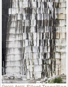 Wall of stone blocks, brick pile below, on white cover, Georg Aerni Silent Transition in beige font below