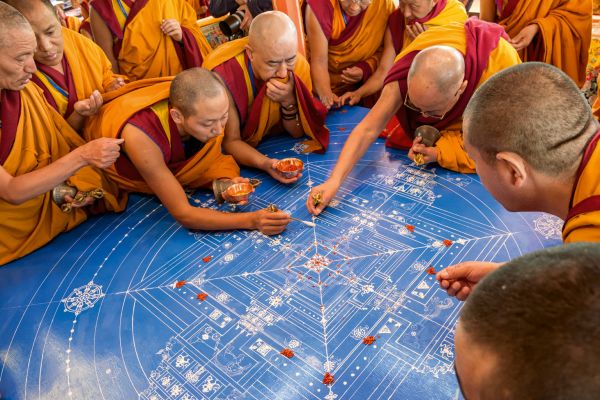 Book cover of Dalai Lama: Photographs by Manuel Bauer. 1990-2024: featuring a portrait of the head of Tibetan Buddhism. Published by Scheidegger & Spiess.