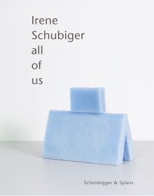 Book cover of Irene Schubiger:All of Us; featuring a two pale blue shapes; one on top of the other. Published by Scheidegger & Spiess.