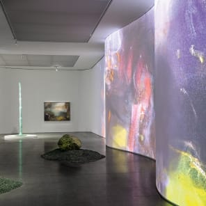 Book cover of Leiko Ikemura: The Sea in the Mountains; featuring a painting of mountains. Published by Scheidegger & Spiess.