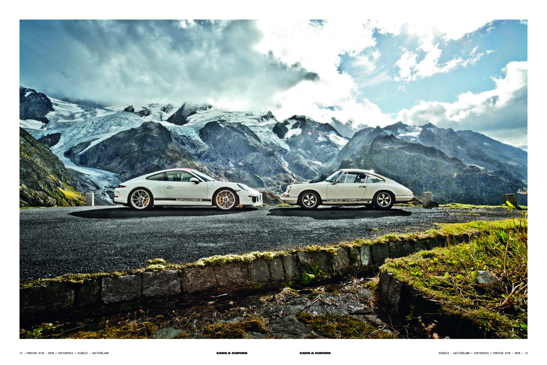 Two white Porsche models parked on mountain roadside, on grey cover of 'Cars & Curves, A Tribute to 70 Years of Porsche', by Delius Klasing.