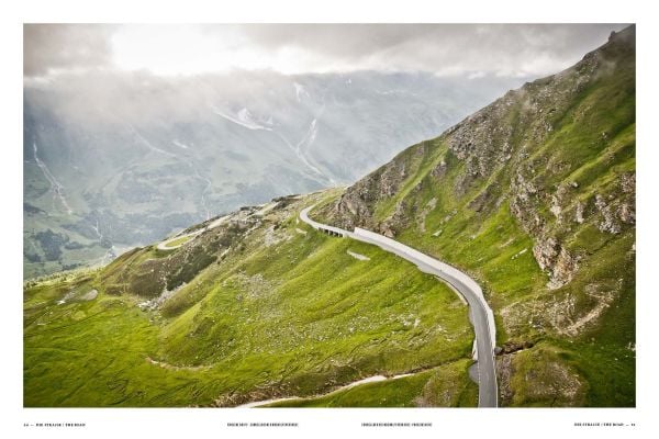 Hairpin bend in road with snow-topped mountains behind, on cover of 'Pass Portrait - Grossglockner, Austria 2504M', by Delius Klasing.
