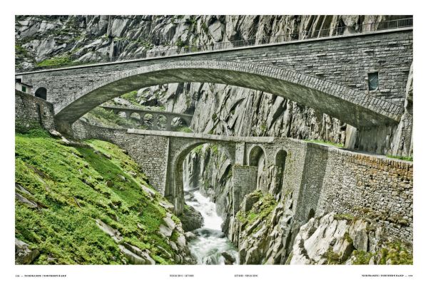 High angle shot of Swiss Alps with winding roads, on cover of 'Porsche Drive - Pass Portrait - Gotthard, Schweiz - Switzerland - 2106 m', by Delius Klasing.