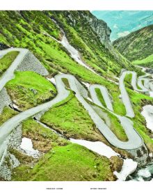 High angle shot of Swiss Alps with winding roads, on cover of 'Porsche Drive - Pass Portrait - Gotthard, Schweiz - Switzerland - 2106 m', by Delius Klasing.