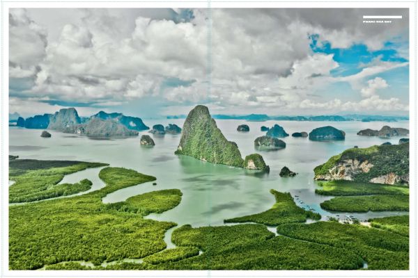 High angled shot of lush green mountainous landscape on cover of 'Curves: Thailand, Band 12: Norden/North // Süden/South', by Delius Klasing.